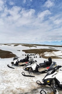 Snowmobiles in rows