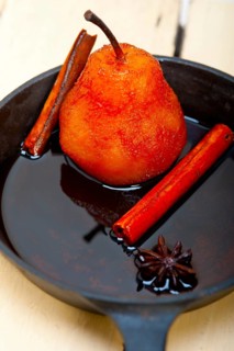 Poached pears delicious home made recipe ove white rustic wood table