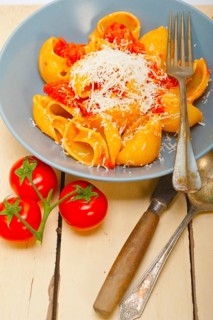 Italian snail lumaconi pasta with ripe cherry tomatoes sauce ingredients