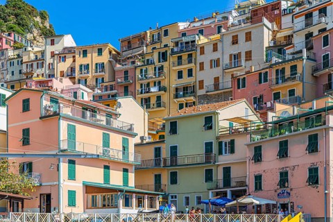 The village of Manarola with its nested pastel-coloured houses built into the hillside