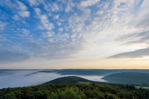 View from Katzenbuckel mountain with morning mist