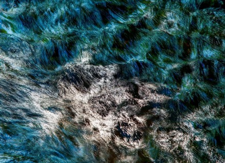 Flowing water with light reflections