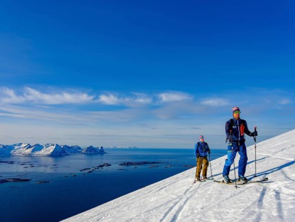 Two ski tourers on the ascent above Bergsfjord
