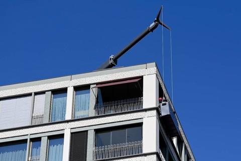 Apartment block with facade lift