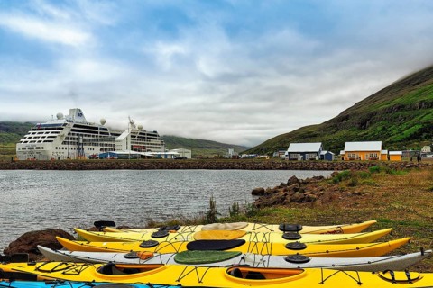 Colourful Kayaks on the Shore of the Fjord