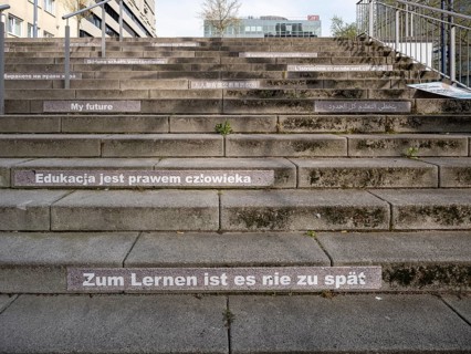 Stairway steps with slogans on the subject of education in several languages