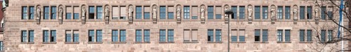 Thirteen stone sculptures of historical jurists on the main facade of the Justice Building