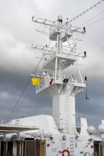 Cruise ship with yellow flag