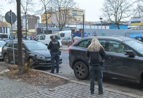 Police officers writing parking tickets