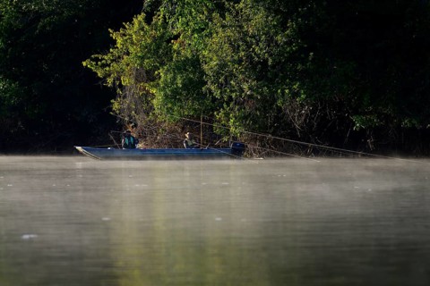 Two anglers in a boat on the Rio Sao Lourenco