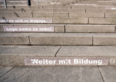 Stairway steps with slogans on the subject of education in several languages