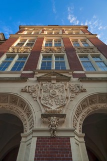 Main facade of the primary school with the old city coat of arms of Goerlitz