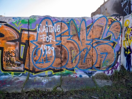 Graffiti on wall remains behind the Urban Gardening project at a new development area at the Old Harbour