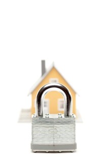 Lock and house isolated on a white background