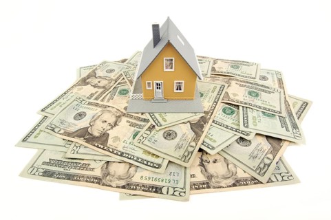 Home and money isolated on a white background