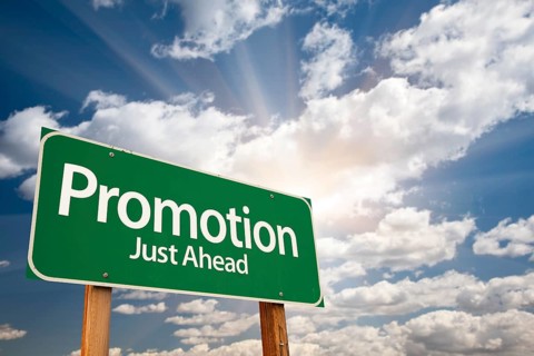 Promotion green road sign with dramatic clouds and sky