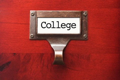 Lustrous wooden cabinet with college file label in dramatic light