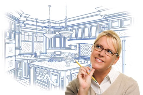 Daydreaming woman with pencil over custom kitchen design drawing isolated on white