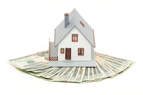 Home and money isolated on a white background