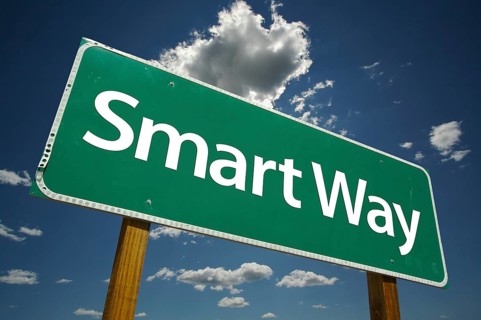 Smart way green road sign with dramatic clouds and sky