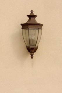 Beautiful lamp on stucco wall