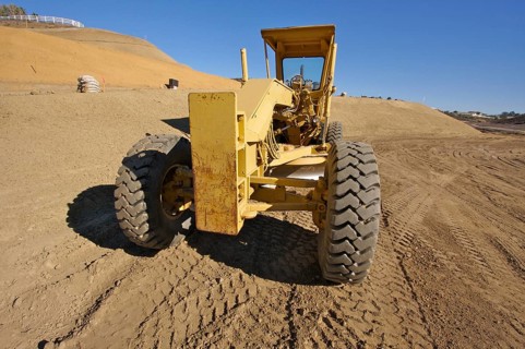Tractor at a construction site and dirt lot