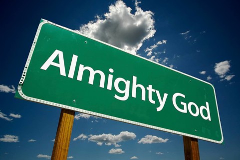 Almighty god green road sign over dramatic clouds and sky