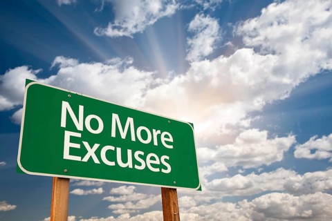No more excuses green road sign with dramatic clouds and sky