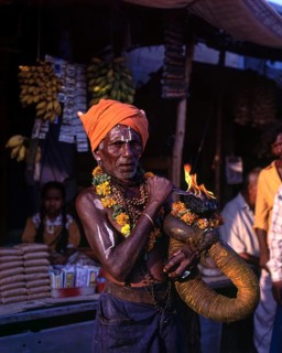 A devotee holding fire torch