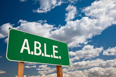 Able green road sign and dramatic clouds background