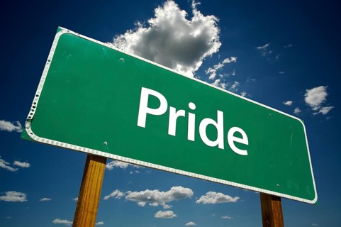 Pride road sign with dramatic clouds and sky