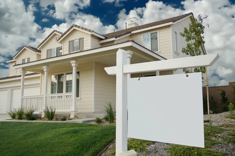 Blank real estate sign & new home ready for your own message