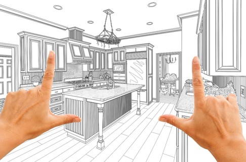 Female hands framing custom kitchen design drawing
