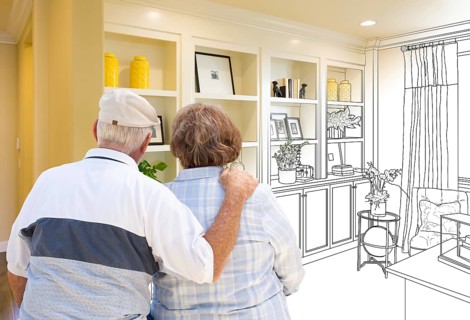 Senior couple facing custom built-in shelves and cabinets design drawing gradating to finished photo
