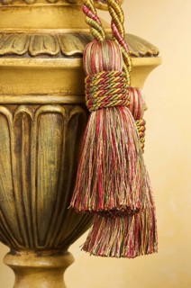 Lamp on table with ornate hanging tassel