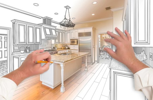 Male hands sketching with pencil A custom kitchen with photo showing through