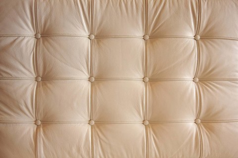 Comfortable buttoned leather pattern with dramatic lighting