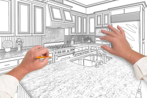 Male hands sketching with pencil the outline of a beautiful custom kitchen