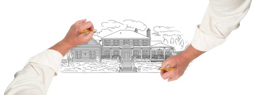 Male hands sketching with pencil the outline of a beautiful house on white
