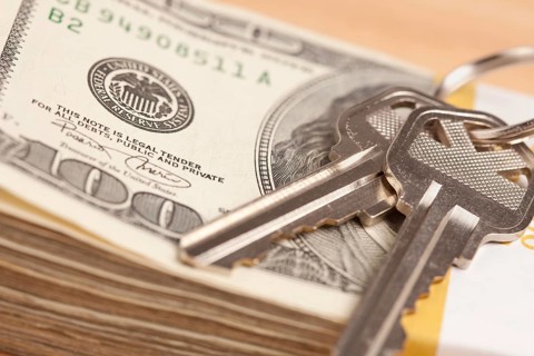 House keys on stack of money