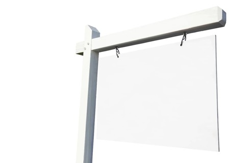 Blank white real estate sign ready for your own message