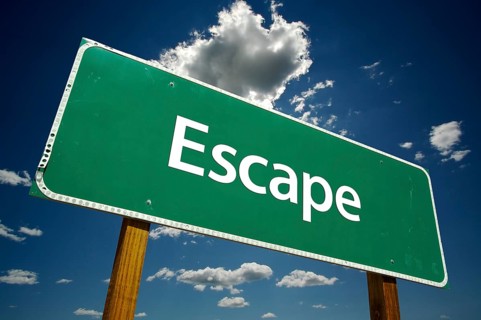 Escape road sign with dramatic clouds and sky