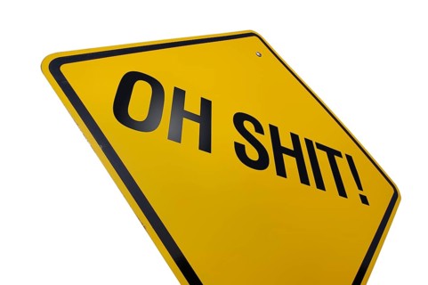 Yellow oh shit! road sign isolated on a white background with clipping path