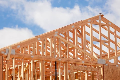 Abstract of wood home framing at construction site