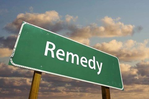 Remedy green road sign with dramatic clouds and sky