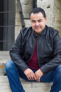 Headshot portrait of handsom hispanic man