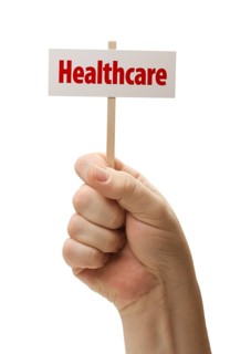 Healthcare sign in male fist isolated on A white background