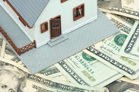 Home and money on a money background