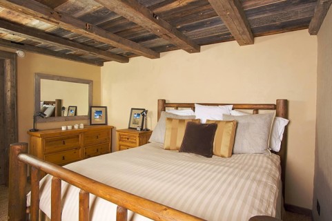 Luxurious rustic log cabin bedroom in a rural setting