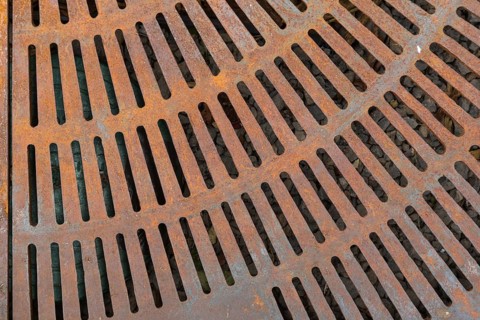 Rusty metal street grate